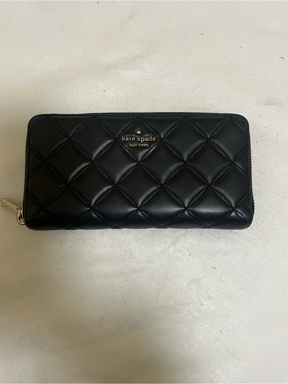 kate spade Black Quilted Zip-Around Wallet with Gold Logo